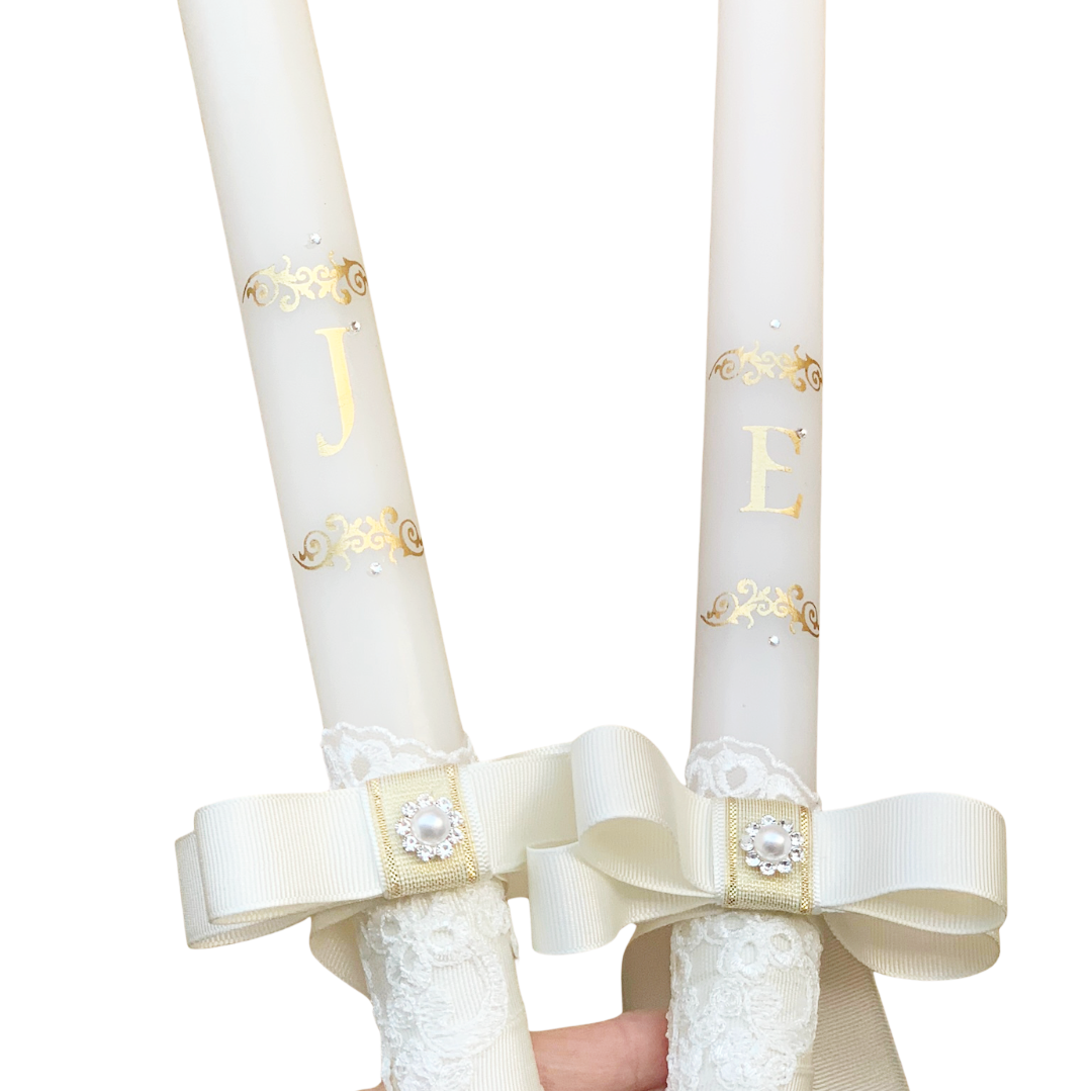 wedding candles with gold initials ivory bow and lace decoration