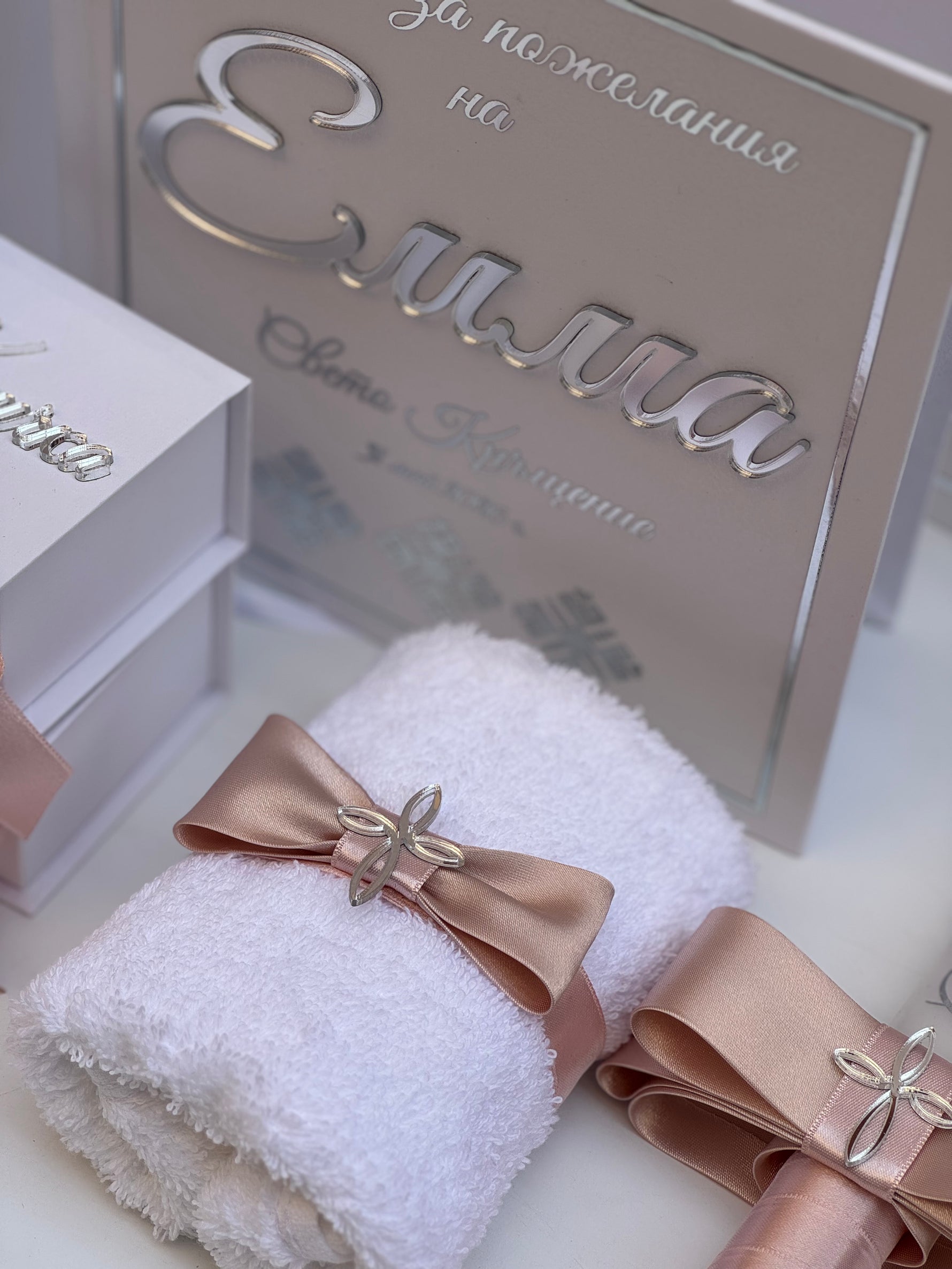 White towel with a pink ribbon and Acrylic Glass Book for Baptism 