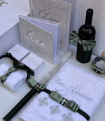 Christening set with large white box, with engraved in silver towels, small box for hair and soap, accessories and a decorated bottle of a red wine