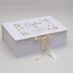 White box with gold ribbon and personalized text 