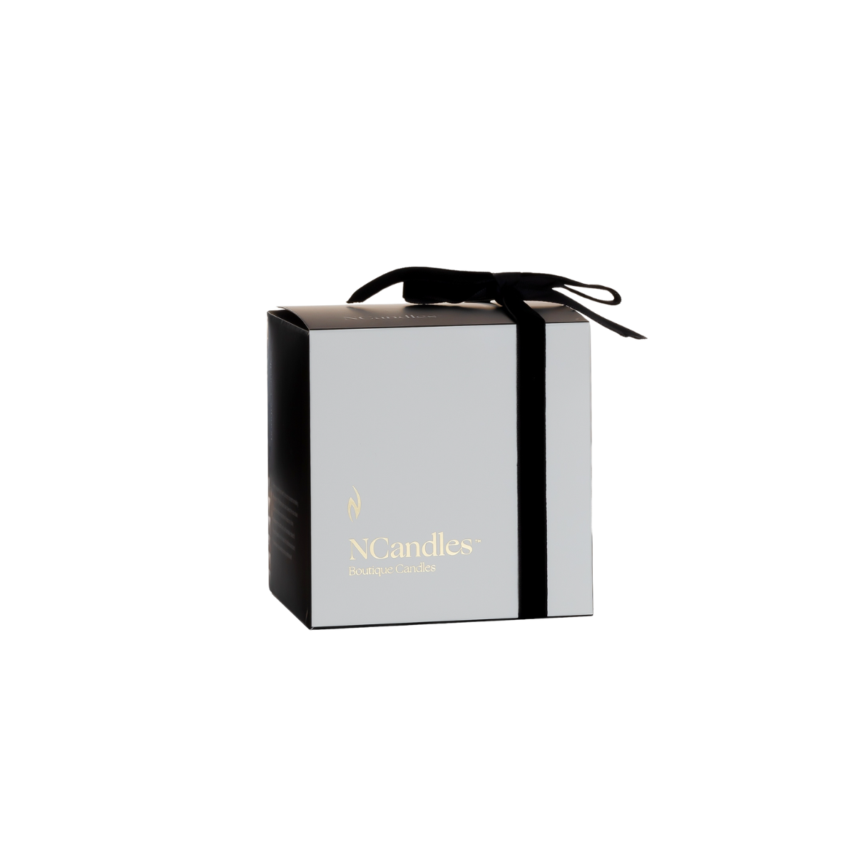A white and black gift box, NCandles branded, tied with a black ribbon.