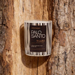 Palo Santo scented candle by NCandles against a wooden background