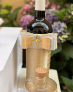 Red Wine Bottle with decorative bow for baptism rituals 