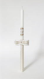 Handmade personalised ecru baptism candle with elegant layered bow and lace details.