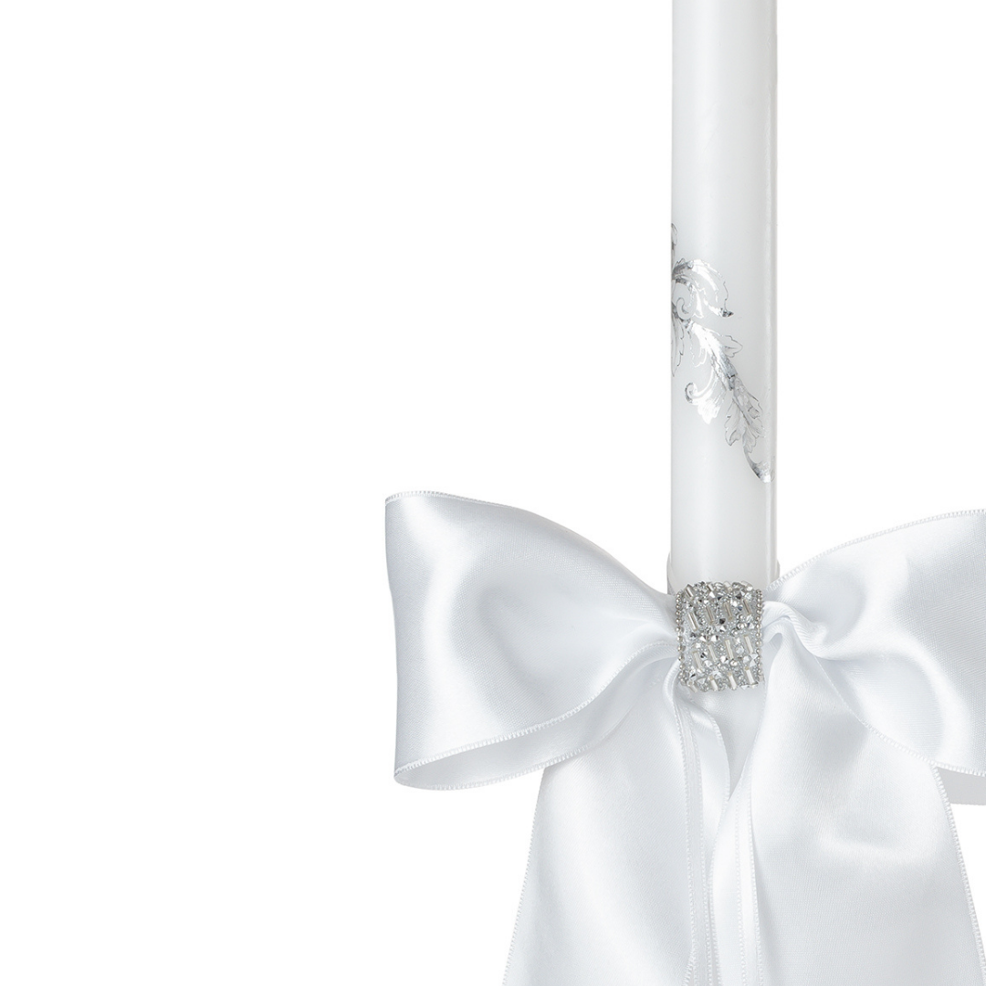 Handcrafted white wedding ritual candles with satin bows and crystal detail connected with ribbon for church ceremony