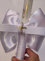 Traditional white and gold personalized baptism candle with gold inscription